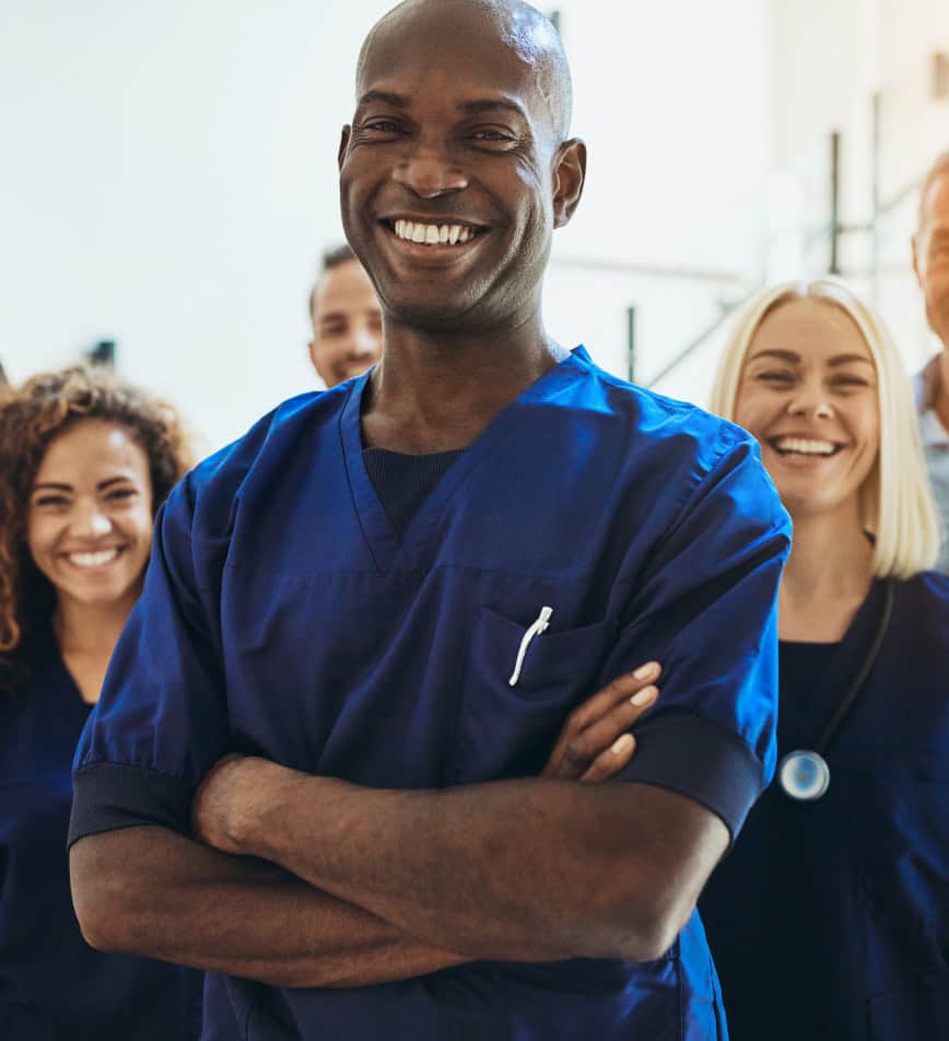 Diverse medical team standing together smiling